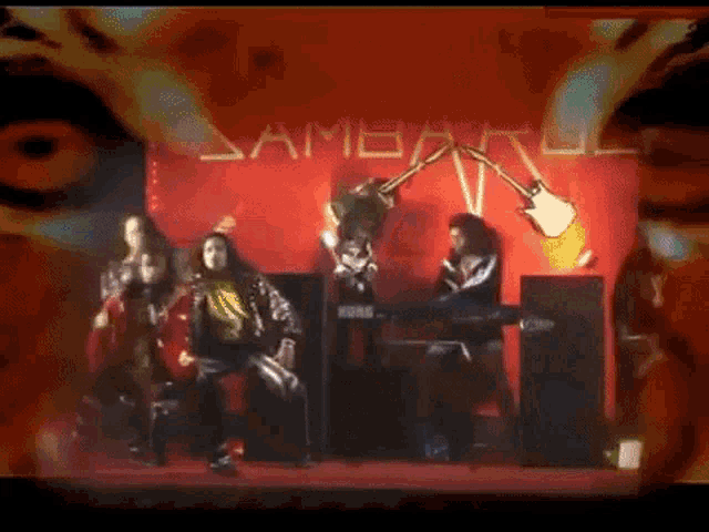 a group of people are standing in front of a red wall that says ' ambarul ' on it