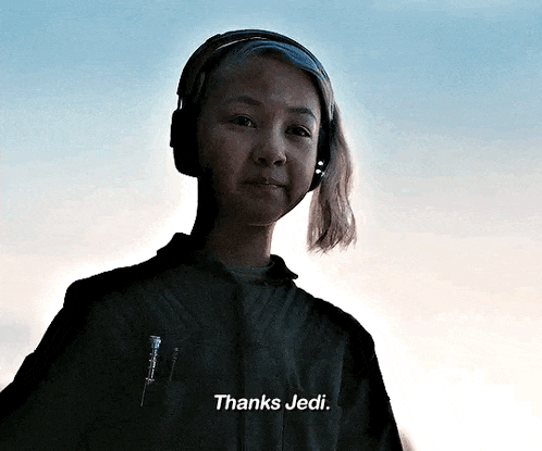a woman is wearing headphones and says thanks jedi