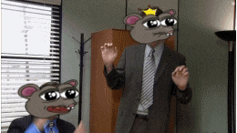 a man in a suit and tie with a cartoon mouse head