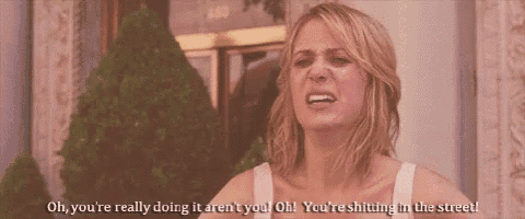 a woman is making a funny face and saying oh you 're really doing it