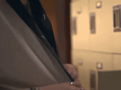 a close up of a person 's torso with a ring on their finger