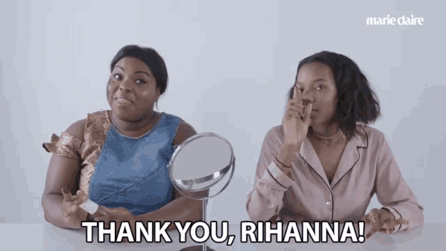 a woman says thank you rihanna while another woman looks at herself in a mirror