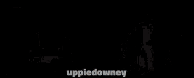 a group of people playing roulette in a casino with the words uppiedowney on the bottom right