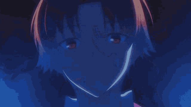 a woman in a red shirt is being held by a person in a blue light