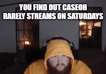 a man with a beard wearing a yellow hoodie and headphones is sitting in front of a computer .