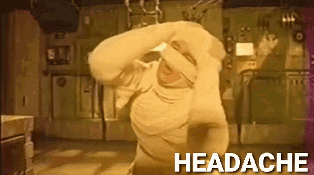 a man wrapped in a bandage has a headache in the background
