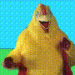 a close up of a yellow chicken with a blue sky behind it