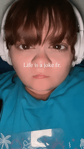 a woman wearing headphones has the words life is a joke fr. written on her face