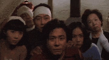 a group of people with bandages on their faces are looking at the camera