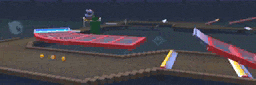 a blurred image of a video game track with a few balls going down it