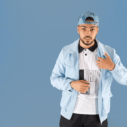 a man wearing a blue hat and a white shirt that says aldi on it