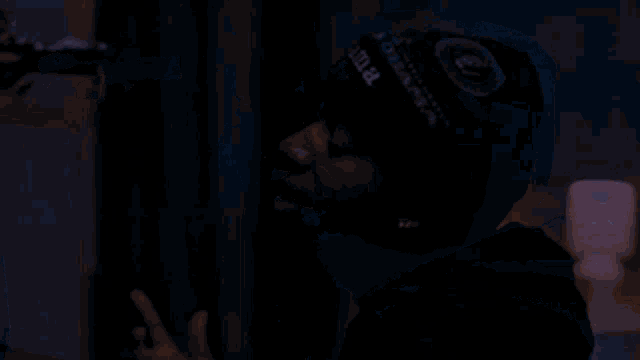 a man wearing a black beanie that says james