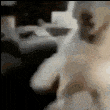 a blurred image of a person 's face with a black and white background
