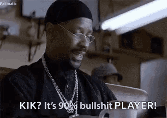 a man wearing glasses and a hat is talking about being a bullshit player in a movie .