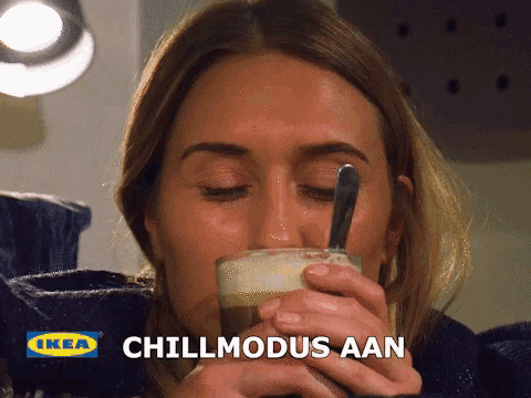 a woman drinking a cup of coffee with the words chillmodus aan written on the bottom
