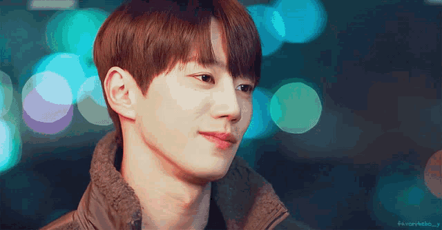 a close up of a man 's face with a blurry background and the words favorhello j on the bottom