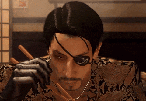 a man with a snake tattoo on his eye is eating with chopsticks