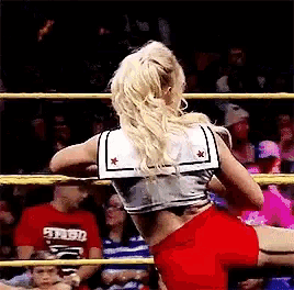 a woman in a sailor top stands in a ring