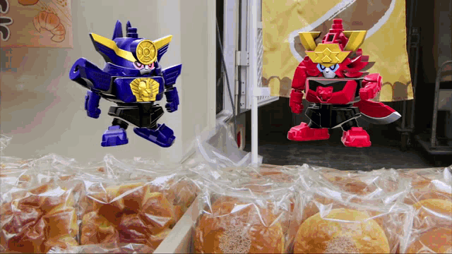 a blue robot and a red robot are standing next to each other