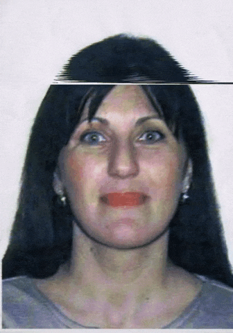 a close up of a woman 's face with long black hair