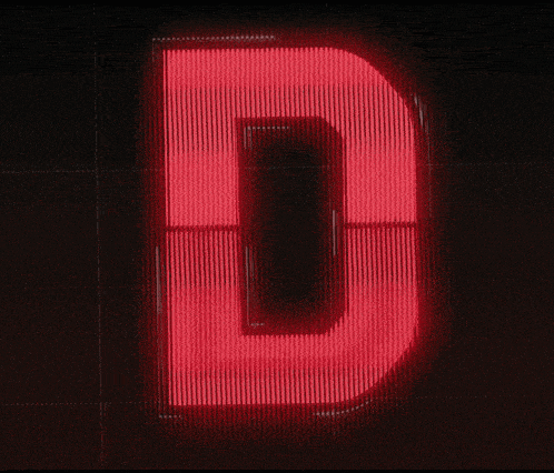 a large red letter d is lit up in the dark