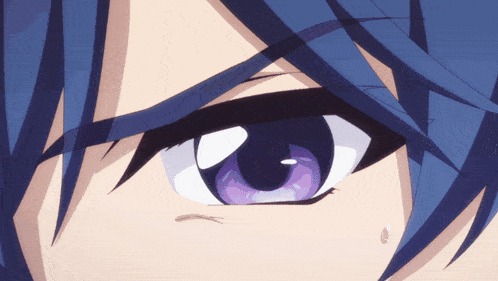 a close up of a person 's eye with purple eyes
