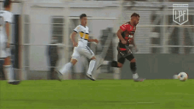 a blurry picture of a soccer game with the word fifa on the bottom right corner