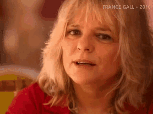 a close up of a woman 's face with france gall 2010 in the corner