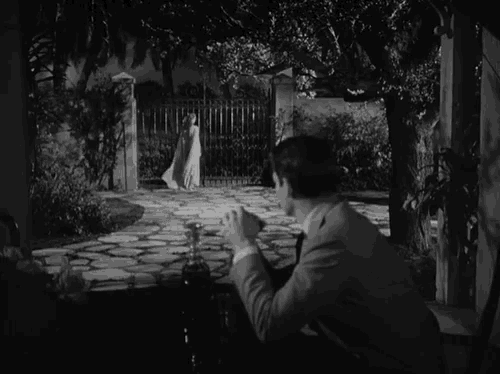 a black and white photo of a man and woman