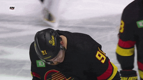 a hockey player wearing a helmet that says nexgen