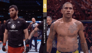 two men are standing next to each other in a boxing ring and one has a shirt that says crypto.com on it