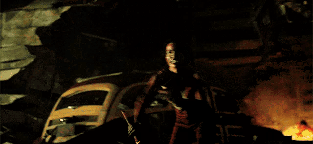 a woman is holding a torch in her hand in front of a car .