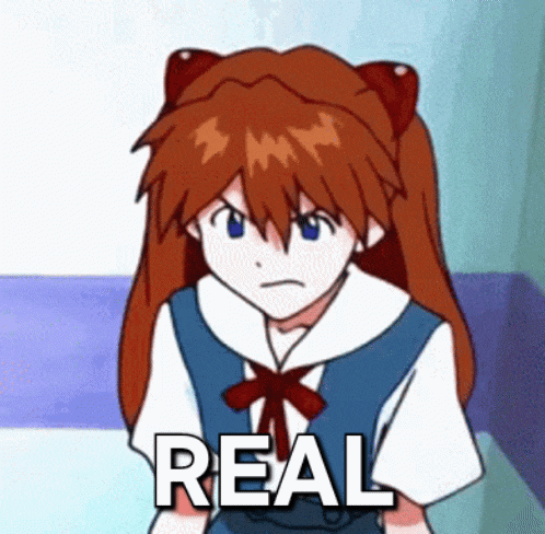 a cartoon girl with red hair is sitting on a couch with the word real written on her chest .