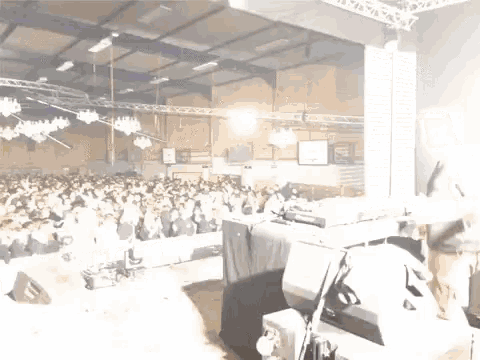 a blurred image of a large room with a sign on the wall that says ' a ' on it
