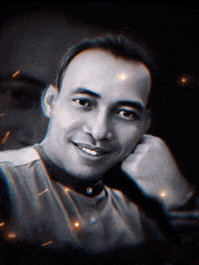 a black and white photo of a man smiling