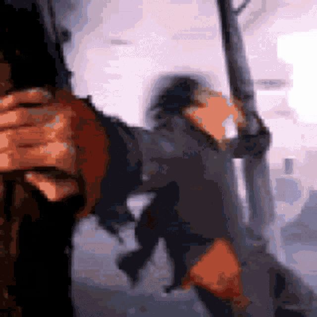 a blurry picture of a man holding a sword