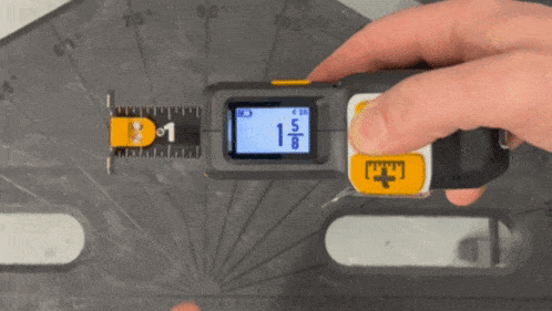 a person is measuring something with a tape measure that says 1/8