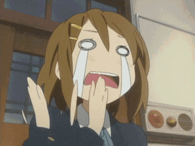 a cartoon girl is crying with a tear coming out of her mouth