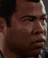 a close up of a man 's face with sweat coming out of it