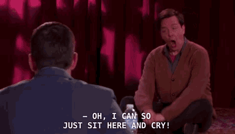a man sits on the floor talking to another man who says " oh i can so just sit here and cry "