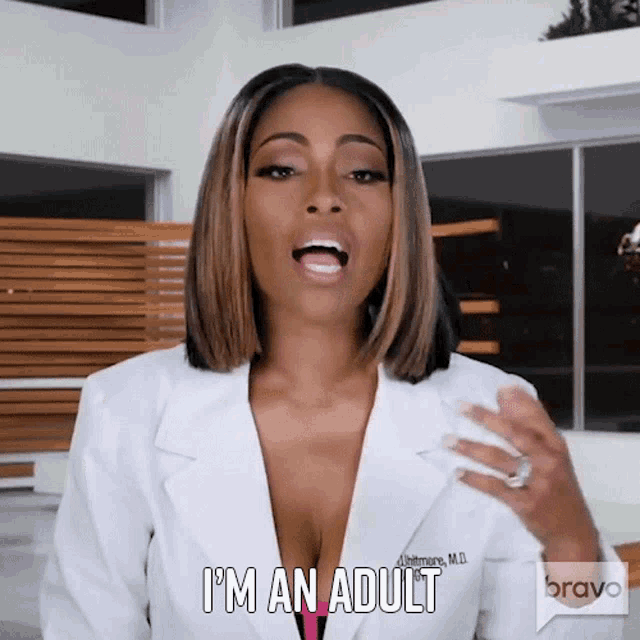 a woman in a white lab coat says i 'm an adult