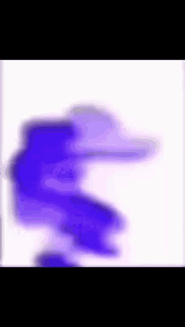 a blurry picture of a person in a purple outfit