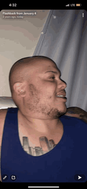 a man with a tattoo on his chest has a flashback from january 4 on his phone screen