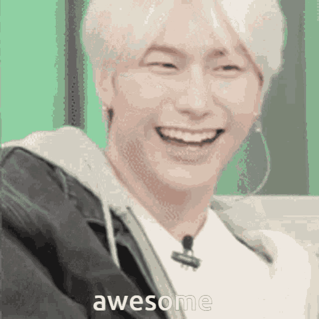 a close up of a person laughing with the words awesome written on the bottom .