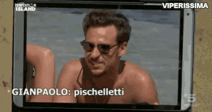 a shirtless man wearing sunglasses is on a cell phone screen with the words gianpaolo pischelletti