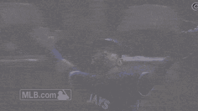 a blue jays baseball player is looking up at the sky