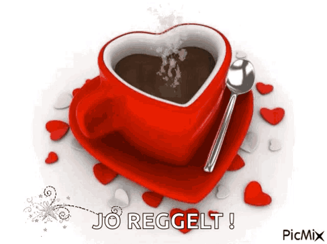 a cup of coffee in the shape of a heart with a spoon