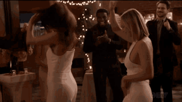 a group of people are dancing in a room with a ctv logo on the bottom