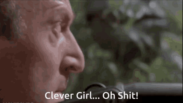 a close up of a man 's face with the words clever girl oh shit written below it .