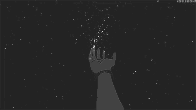 a person 's hand is reaching out towards the stars in the night sky .